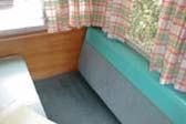 1962 Shasta 1500 trailer dining area, new bench seats and curtains